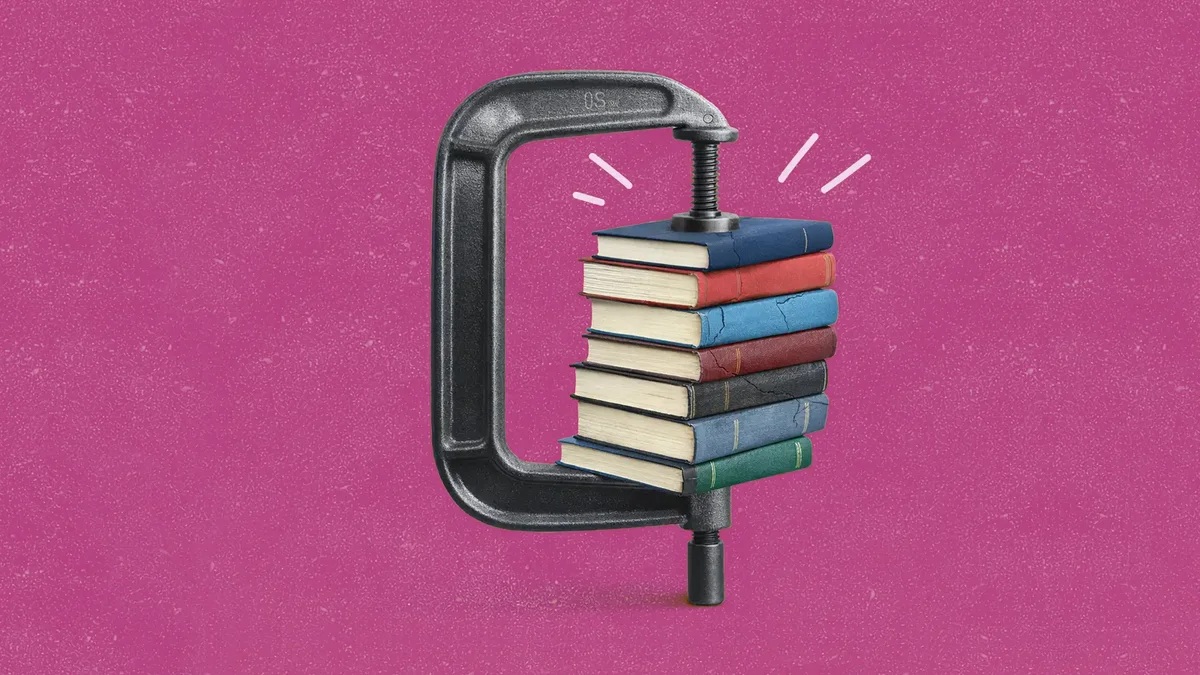 A stack of multicolored books squeezed in a metal C-clamp on a textured magenta background