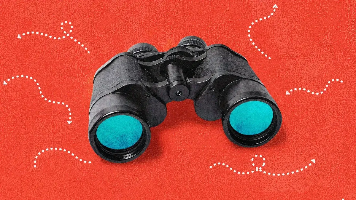 A pair of black binoculars with teal lenses on a textured red background, ringed by white dotted arrow trails