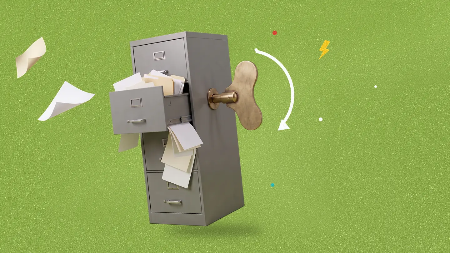 A gray filing cabinet with a brass wind-up key in its side, a drawer spilling papers and loose sheets flying off, with a curved white arrow showing the key turning, on a green background.