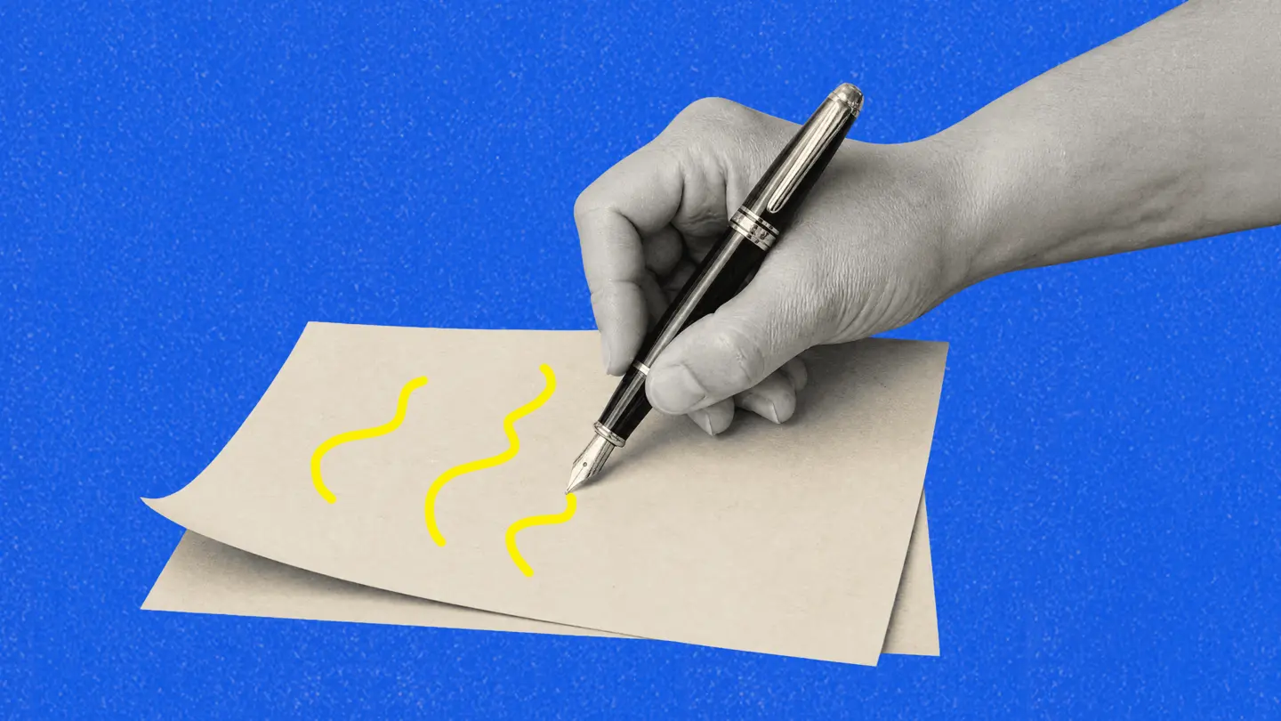 A hand holding a fountain pen drawing squiggles on a sheet of paper, on a blue background