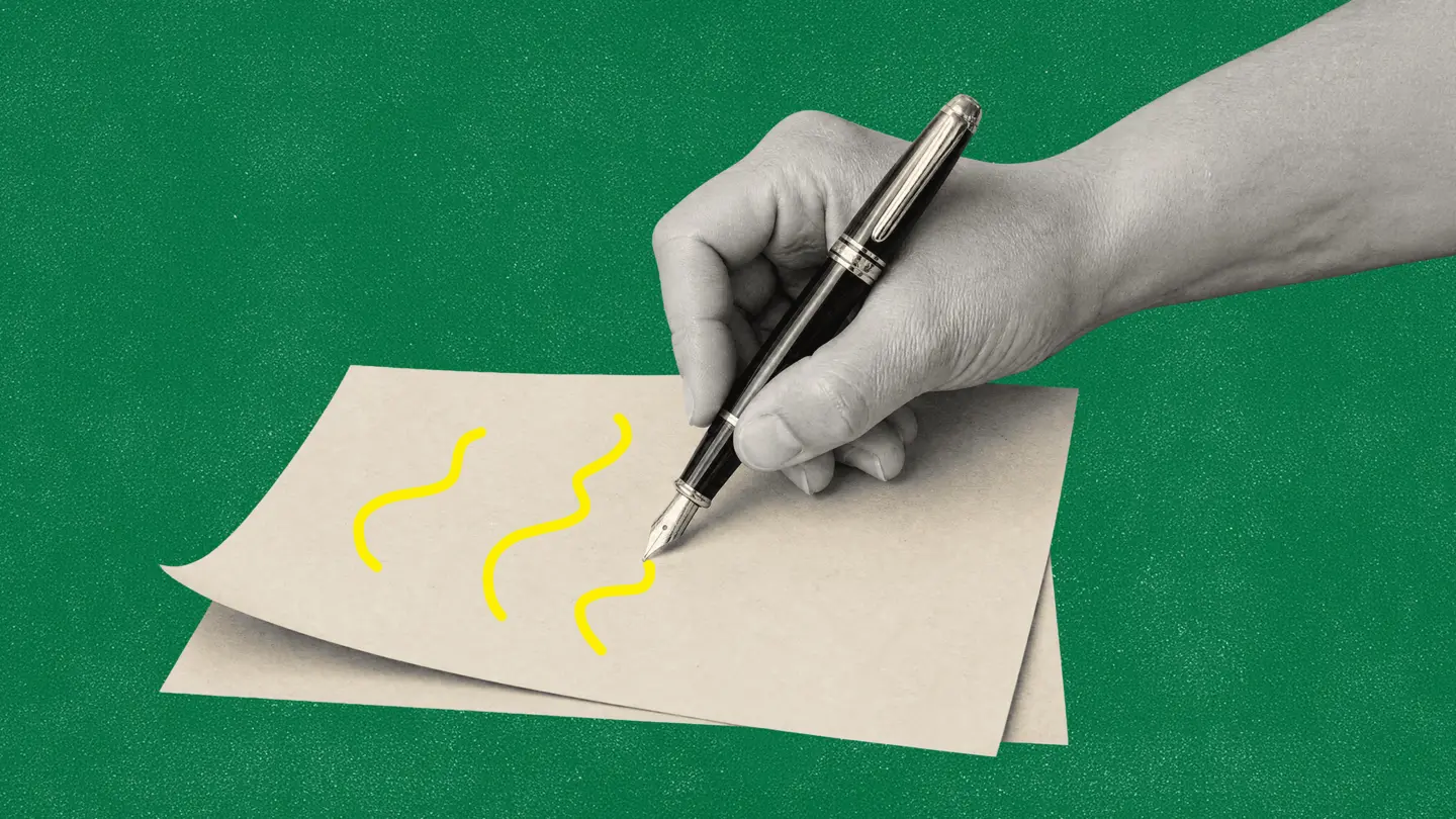 A hand holding a fountain pen drawing squiggles on a sheet of paper, on a dark green background